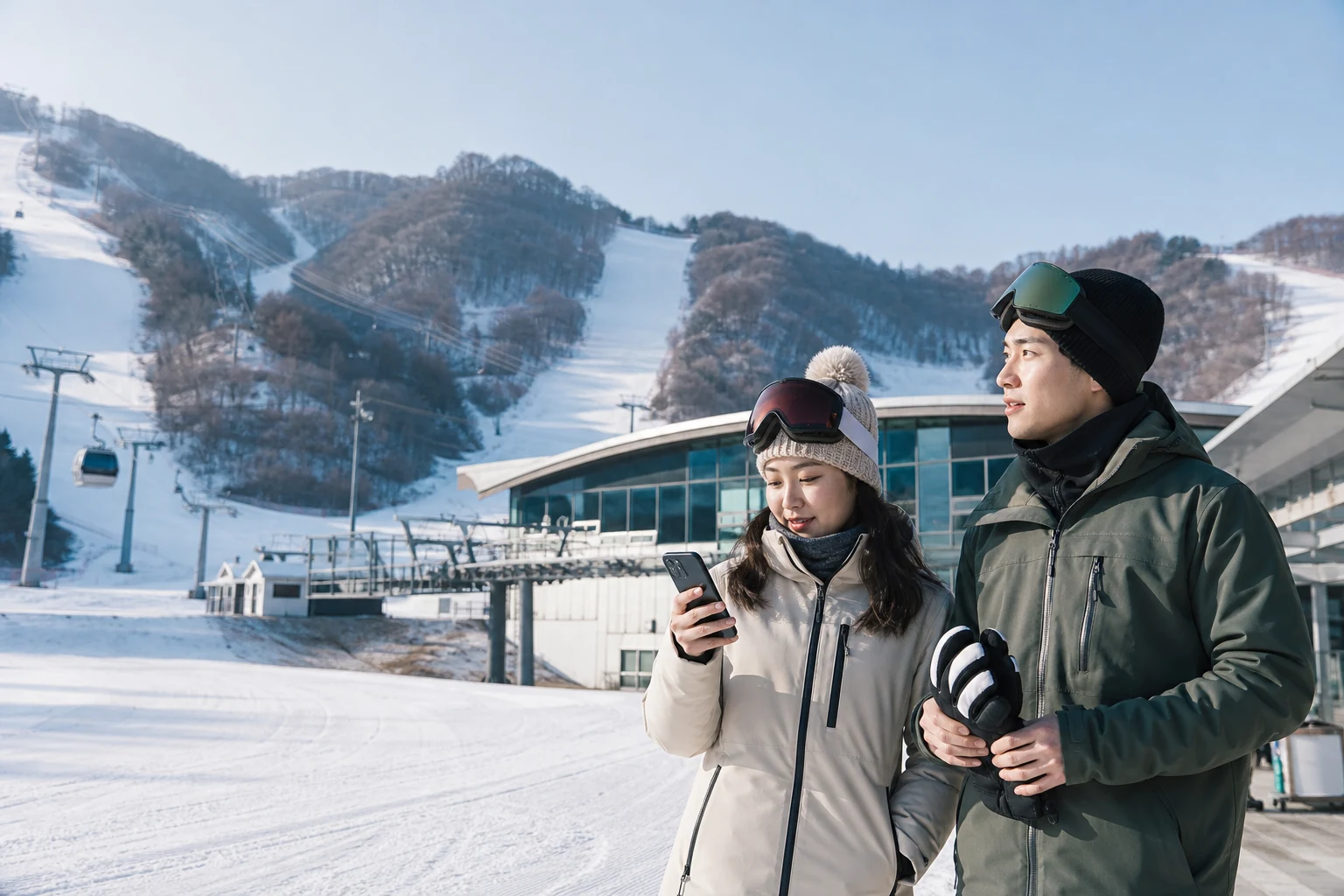 韓国のスキー場ベースでスマホと送迎の段取りを確認する旅客